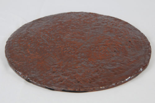 Plaque ronde pour poser des kokedamas, émaillé rouge rouille.